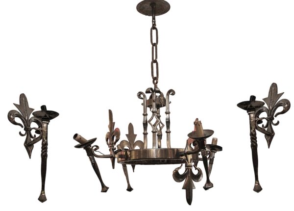 French-style wrought iron chandelier with four torchiere arms and two matching fleur de lis sconces, shown together in a chrome finish.