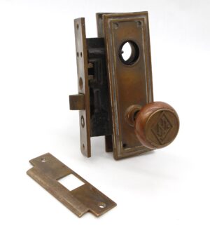 Antique bronze entry door knob set with mortise lock, back plate, and strike plate, showing a round knob with an LN emblem.