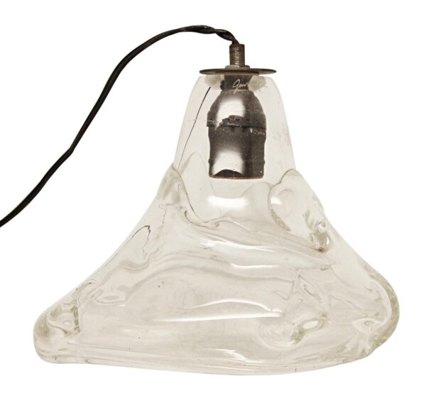 Clear rippled glass pendant light with a cord and metal socket, shown in a close-up view.