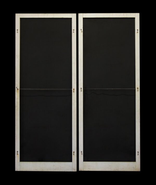 Pair of white vintage screen entry doors shown side by side with wood frames and intact screen panels.
