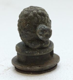 Cast iron turtle mold with a black finish, shown upright on a round base and viewed from the front.
