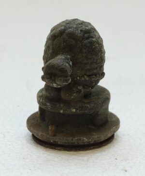 Cast iron turtle mold with a black finish, shown from the front on a round base.