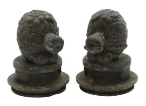 Pair of cast iron turtle molds shown side by side, each with a rounded shell form and a circular base, in a dark black finish.