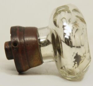 Antique passage door knob with faceted mercury glass, etched details, and a wide brass shank shown in side view.
