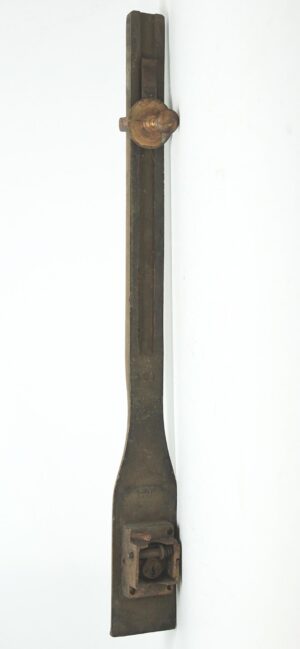 Antique brass commercial door pull shown vertically, with a round knob near the top and mounting hardware visible at the bottom.