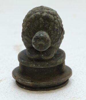 Single cast iron mold with a turtle-shaped top and round base, shown front view.