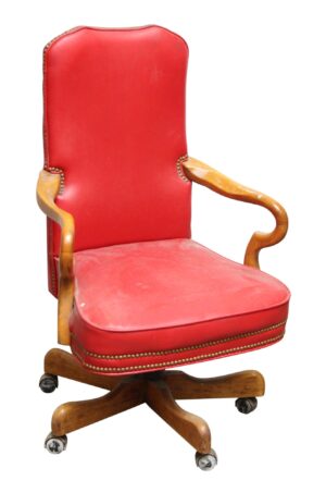 Traditional rolling chair with red studded leather upholstery, light wood tone arms and base, and caster wheels.