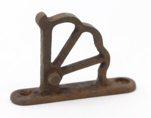 Antique train car window hinge part made of cast iron with a short base and arched frame, shown in close-up on a white background.