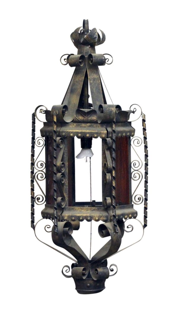 Antique black iron ceiling lantern with ornate scrollwork, a central bulb socket, and a hanging chain.