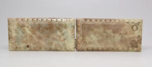 Pair of ceramic tiles with beveled edges, shown side by side with a crackled glaze and visible wear.