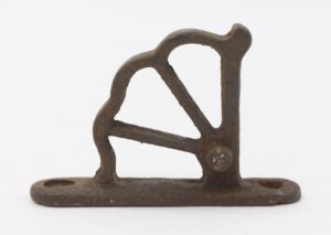 Antique cast iron train car window hinge part with a short base and arched cutout design.