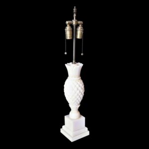 Art Deco table lamp with a carved pineapple-shaped base, brass mount, and two bulb sockets with pull chains.