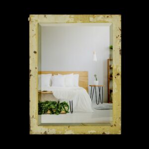 Reclaimed steel cabinet door with a beveled mirror and heavily distressed tan and off-white paint.