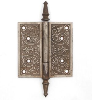 Victorian cast iron butt door hinge with steeple tips, three knuckles, and decorative template holes shown closed.