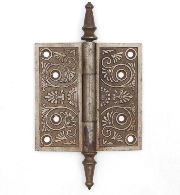 Victorian cast iron butt door hinge with steeple tips, three knuckles, and decorative template holes shown closed.