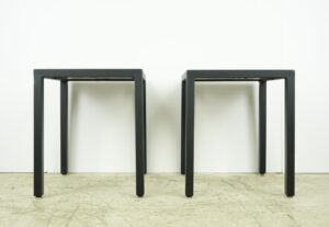Pair of square side tables with black steel frames and dark wood tops, shown together in a front view.