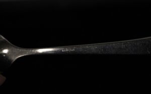 Stainless steel tablespoon with the Sambonet name stamped on the handle.