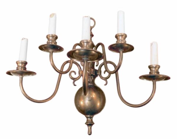 Colonial-style five-arm wall sconce with a copper finish, shown front view with five candle-style holders and a central round backplate.