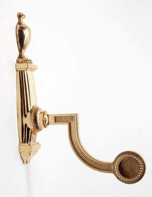 Polished brass towel bar bracket with an ornate traditional design and curved arm shown in profile.