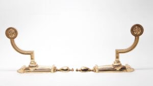 Pair of traditional polished brass towel bar brackets shown as a matching pair, each with a curved arm and round decorative top medallion.