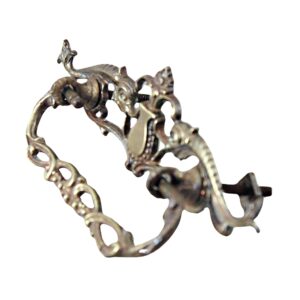 Ornate Victorian-style brass dresser bail pull with a cutout design and visible mounting posts.