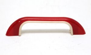 Mid century plastic bridge drawer pull in red and cream with a rounded handle profile.