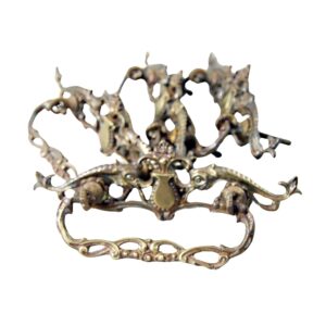 Ornate Victorian brass dresser bail pull with a cutout design and antique brass finish, shown front on.
