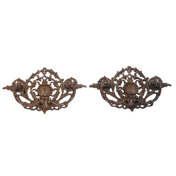 Pair of Victorian bronze drawer bail pulls with cut-out shell details, shown as a pair.