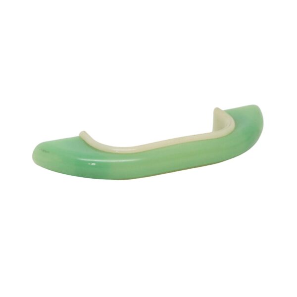 Mid Century bridge drawer pull in green and white plastic, shown in a curved side view.