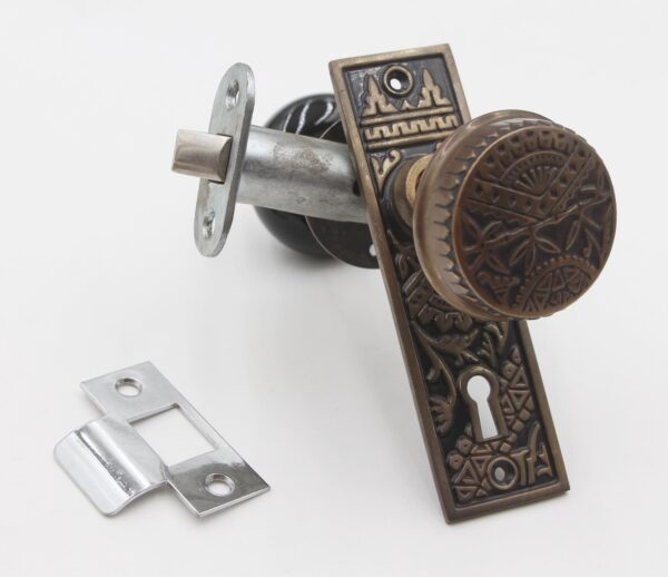 Door Knob Sets - Oriental Brass & Black Ceramic Passage Door Knob Set