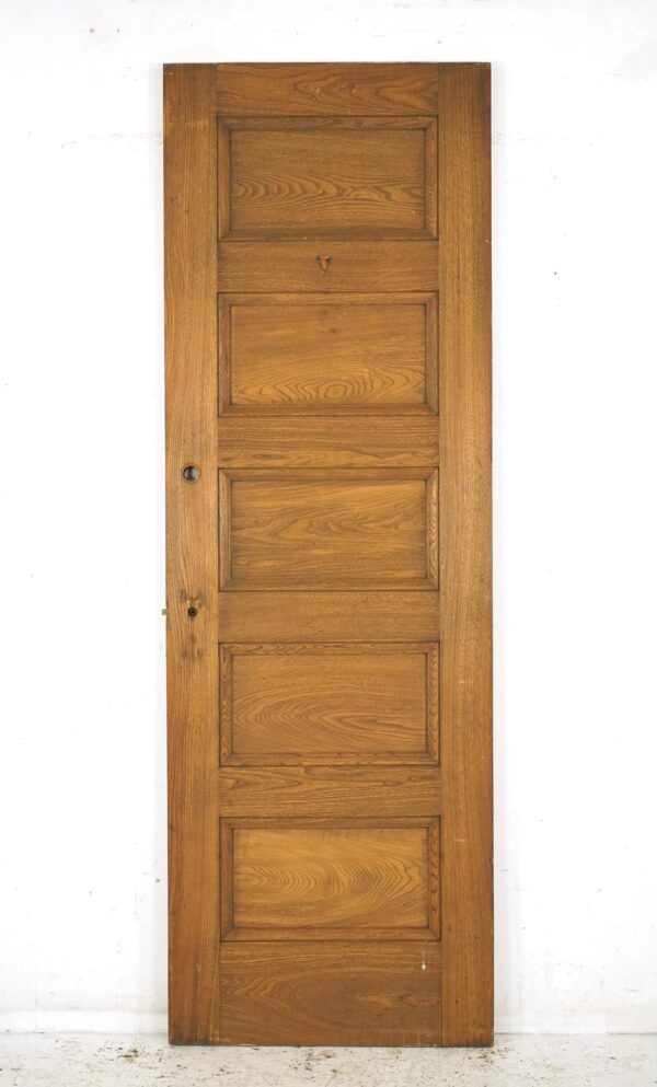 Vintage privacy door with five horizontal panels and an attached mortise lock, shown upright.