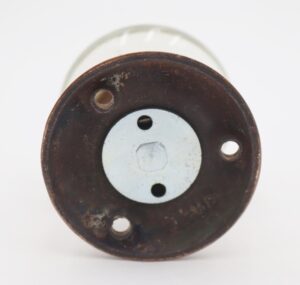 Round glass dummy door knob with an antique brass rosette, shown from the back with mounting holes and surface wear.