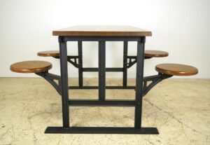 Angled view showing the swing table’s black frame and attached circular wooden seats beneath the rectangular tabletop. Close-up of one round seat, highlighting the wood grain and connection to the black metal support bar. Side view showing four wooden seats evenly spaced along the table’s length, all supported by a sturdy metal base. Perspective shot focusing on where a seat attaches to both frame and table, revealing hardware details.