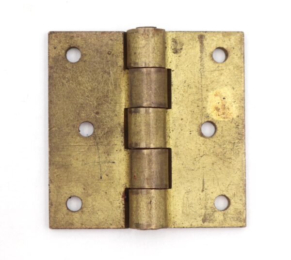 Vintage brushed brass cabinet hinge with five knuckles and four screw holes, shown flat from the front.