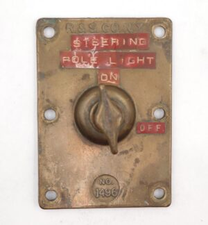 Antique brass ship light switch with a T-shaped knob, stamped No. 1496 and marked R.&S. Co. N.Y., shown front on with four mounting holes and visible surface wear.