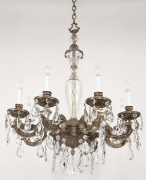 Victorian-style chandelier with an ornate bronze frame, eight candle-style sockets, and clear crystal prisms hanging from the arms.