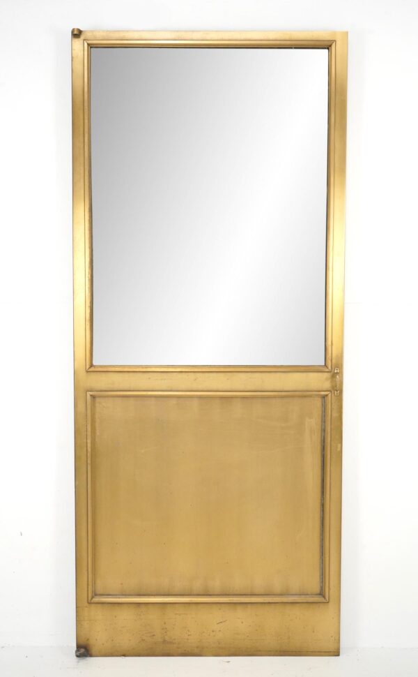 Brass-framed mirrored door with a single upper glass panel and lower solid panel.