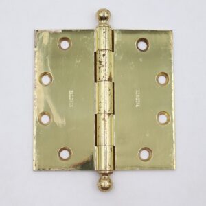 Polished brass door hinge with ball tips, five knuckles, and six mounting holes, shown front view with visible surface wear.