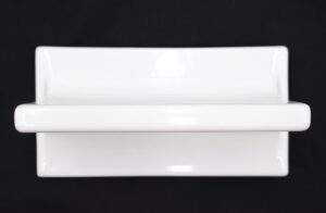Rectangular white ceramic bathroom shelf shown front on, with a raised ledge and rounded edges.