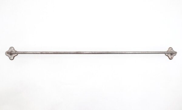 Vintage steel towel bar with clover-shaped backplates and a long horizontal rod.