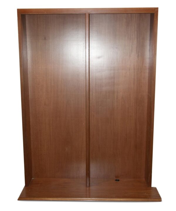 Pair of dark wood tone built-in bookcases shown front on with two tall compartments and a wide base.