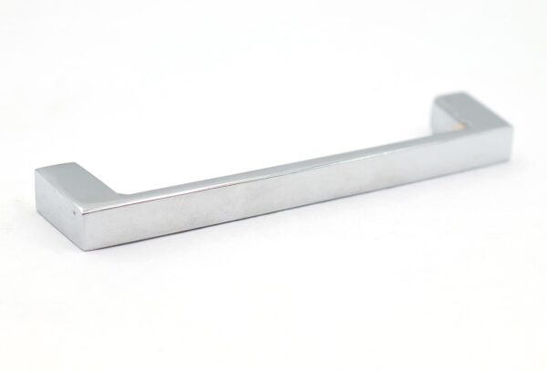 Modern chrome cabinet pull with a straight bar and squared ends, shown in a single angled view.