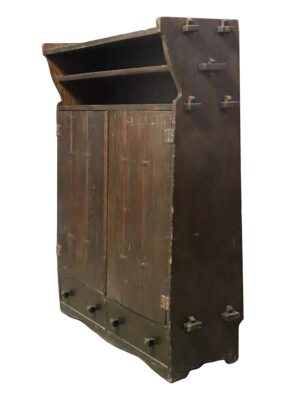 Arts and Crafts oak storage cabinet with open upper shelving, paneled doors, and butterfly pegs on the side and base.
