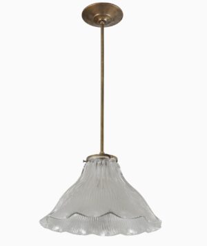 Pendant light with an antique brass pole and a clear ruffled glass shade, shown hanging from above.