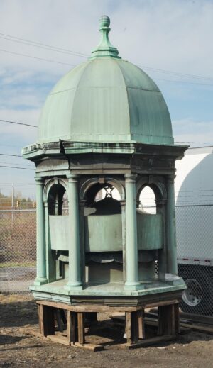 Antique copper cupola with a verdigris finish, shown with a bell-shaped dome, spherical finial, arched openings, and an inner shield with an embossed star.