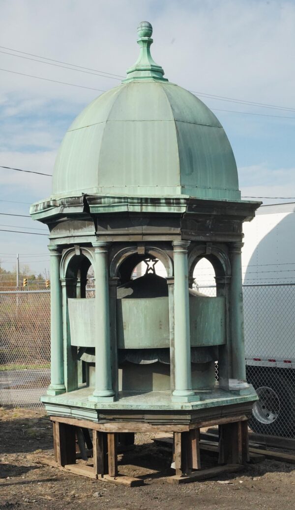 Antique copper cupola with a verdigris finish, shown with a bell-shaped dome, spherical finial, arched openings, and an inner shield with an embossed star.