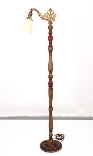 Victorian bridge floor lamp with an ornate arm, turned wood column, bell-shaped shade, and round base.