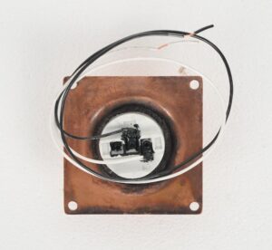 Copper-finish brass flush mount light shown from the back with exposed wiring and a square mounting plate.