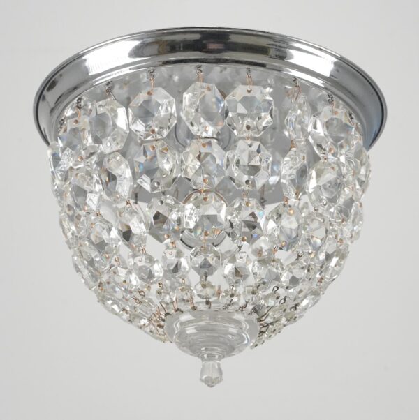 Crystal flush mount ceiling light with draped faceted clear crystals and a polished chrome frame, shown from below.