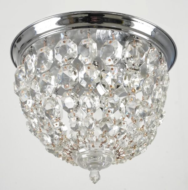 Traditional flush mount ceiling light with draped faceted crystals and a polished chrome frame.